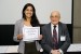 Dr. Nagib Callaos, General Chair, giving Ms. Mariana Ribeiro dos Santos Lima the best paper award certificate of the session "Information Systems, Information Modeling, Data Science, Knowledge Organization and Applications in Smart Cities and Smart Life." The title of the awarded paper is "The Perception of the Urban Quality of Life Index in the Context of Smart Cities."